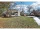 Large backyard with grassy area and partially snow-covered ground at 10322 Sage Ct, Noblesville, IN 46060