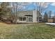 Home's rear view, highlighting the deck and grassy backyard at 10322 Sage Ct, Noblesville, IN 46060