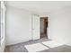 Bright bedroom with carpet, double closet, and access to hallway at 10322 Sage Ct, Noblesville, IN 46060