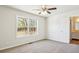 Spacious bedroom with ceiling fan and large window at 10322 Sage Ct, Noblesville, IN 46060