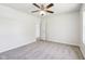 Bright bedroom with ceiling fan and door to a bathroom at 10322 Sage Ct, Noblesville, IN 46060
