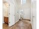 Bright entryway with tiled floor, staircase, and a half-bathroom at 10322 Sage Ct, Noblesville, IN 46060
