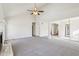 Large living room with vaulted ceilings, fireplace, and neutral carpeting at 10322 Sage Ct, Noblesville, IN 46060