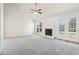 Bright living room featuring a fireplace and sliding glass doors leading to a deck at 10322 Sage Ct, Noblesville, IN 46060