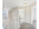 Upstairs hallway with white railing and carpet at 10322 Sage Ct, Noblesville, IN 46060