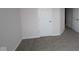 This bedroom features neutral walls, plush carpet, and multiple doorways, great for space at 1144 Ridgevine Rd, Greenwood, IN 46143