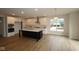 Modern kitchen with a large center island, white cabinetry, stainless steel appliances, and ample counter space at 1144 Ridgevine Rd, Greenwood, IN 46143