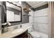 A bright and well-organized bathroom has a granite vanity, stylish mirror and storage shelves at 12301 Van Spronsen Ct, Indianapolis, IN 46236