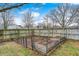 Backyard garden featuring raised garden beds surrounded by a wooden privacy fence at 12301 Van Spronsen Ct, Indianapolis, IN 46236
