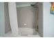 Bright bathroom features a shower and tub combo with decorative shower curtain at 12643 Feldspar Rd, Indianapolis, IN 46236