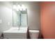 Charming half bathroom featuring stylish vanity, sink, and lighting fixtures at 12643 Feldspar Rd, Indianapolis, IN 46236