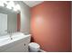 Stylish half bathroom featuring modern vanity, sink, and lighting at 12643 Feldspar Rd, Indianapolis, IN 46236