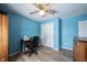 Bedroom with blue walls, ceiling fan, closet and a wooden dresser at 12643 Feldspar Rd, Indianapolis, IN 46236