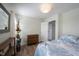 Bright bedroom with decor, wooden floors, and a three drawer dresser at 12643 Feldspar Rd, Indianapolis, IN 46236