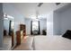 Bedroom with two fans, desk, plants and a bed with white sheets at 12643 Feldspar Rd, Indianapolis, IN 46236