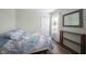 Bright bedroom features blue accents, wood floors, and lots of light at 12643 Feldspar Rd, Indianapolis, IN 46236