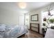 Bright bedroom features plants, wood floors, and lots of light at 12643 Feldspar Rd, Indianapolis, IN 46236