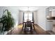 Dining room with hardwood floors, modern chandelier, and access to kitchen at 12643 Feldspar Rd, Indianapolis, IN 46236