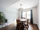 Cozy dining room featuring hardwood floors, a round wooden table, and a stylish chandelier at 12643 Feldspar Rd, Indianapolis, IN 46236