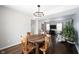 Open-concept dining room leading to a spacious living area with a modern entertainment center at 12643 Feldspar Rd, Indianapolis, IN 46236