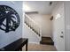 Bright entryway features coat rack, staircase, and front door at 12643 Feldspar Rd, Indianapolis, IN 46236