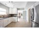 Bright kitchen with stainless steel appliances and views into the breakfast nook at 12643 Feldspar Rd, Indianapolis, IN 46236