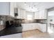 Contemporary kitchen featuring sleek countertops, white cabinets, and stainless steel appliances at 12643 Feldspar Rd, Indianapolis, IN 46236