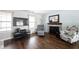 Bright living room featuring hardwood floors, a fireplace, and stylish seating at 12643 Feldspar Rd, Indianapolis, IN 46236