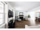 Bright living room boasts hardwood floors, a fireplace, and comfortable seating arrangements at 12643 Feldspar Rd, Indianapolis, IN 46236