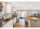 Modern kitchen featuring white cabinets, stainless steel appliances, and a center island at 1442 Northbrook Dr, Indianapolis, IN 46260