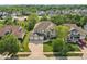 Aerial view of a large home with a three-car garage in a wooded suburban neighborhood at 18725 Wychwood Pl, Noblesville, IN 46062