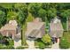 Aerial view of a single Gathering home showcasing the roof, backyard, and surrounding green landscape at 18725 Wychwood Pl, Noblesville, IN 46062
