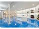 Finished basement featuring bright floors, a white desk, and display shelving at 18725 Wychwood Pl, Noblesville, IN 46062