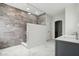Bathroom features a modern walk-in shower and gray marble-style tiling at 18725 Wychwood Pl, Noblesville, IN 46062