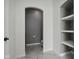 Bright bathroom featuring access to a water closet and built-in shelving at 18725 Wychwood Pl, Noblesville, IN 46062