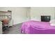 Bright bedroom featuring a bed, furniture, light wood flooring, and bright paint at 18725 Wychwood Pl, Noblesville, IN 46062