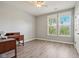 Bedroom featuring two windows, wood floors, and a ceiling fan at 18725 Wychwood Pl, Noblesville, IN 46062