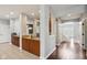 Spacious entryway with hardwood floors, a granite-topped counter, and an open view to the living room at 18725 Wychwood Pl, Noblesville, IN 46062
