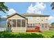 A view of the screened porch and deck on a home with mixed siding and brick exterior at 18725 Wychwood Pl, Noblesville, IN 46062