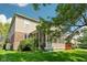 Back exterior featuring a screened porch and a combination of tan siding and brick at 18725 Wychwood Pl, Noblesville, IN 46062