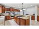 Gourmet kitchen featuring granite countertops, stainless steel appliances, and a gas cooktop island at 18725 Wychwood Pl, Noblesville, IN 46062