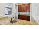 Gourmet kitchen featuring granite countertops, wine rack, cherry cabinets, and modern fixtures, ideal for culinary enthusiasts at 18725 Wychwood Pl, Noblesville, IN 46062