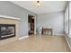 Spacious living room featuring a fireplace and large windows for natural light at 18725 Wychwood Pl, Noblesville, IN 46062