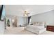 Spacious main bedroom with a ceiling fan, carpet, and neutral decor at 18725 Wychwood Pl, Noblesville, IN 46062
