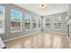Sun-filled sunroom with tile floors and multiple windows offering beautiful views of the outdoors at 18725 Wychwood Pl, Noblesville, IN 46062