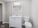 Simple bathroom with white vanity and toilet at 403 Wellington Blvd, Shelbyville, IN 46176