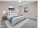 Main bedroom with plush bed and blue accents at 403 Wellington Blvd, Shelbyville, IN 46176