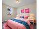 Charming bedroom with pink bedding and teal accents at 403 Wellington Blvd, Shelbyville, IN 46176