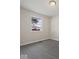 Empty bedroom with grey carpet and a window at 403 Wellington Blvd, Shelbyville, IN 46176