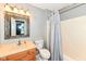Traditional bathroom featuring a vanity, toilet, and shower with curtain at 493 Clearwater Blvd, Whiteland, IN 46184